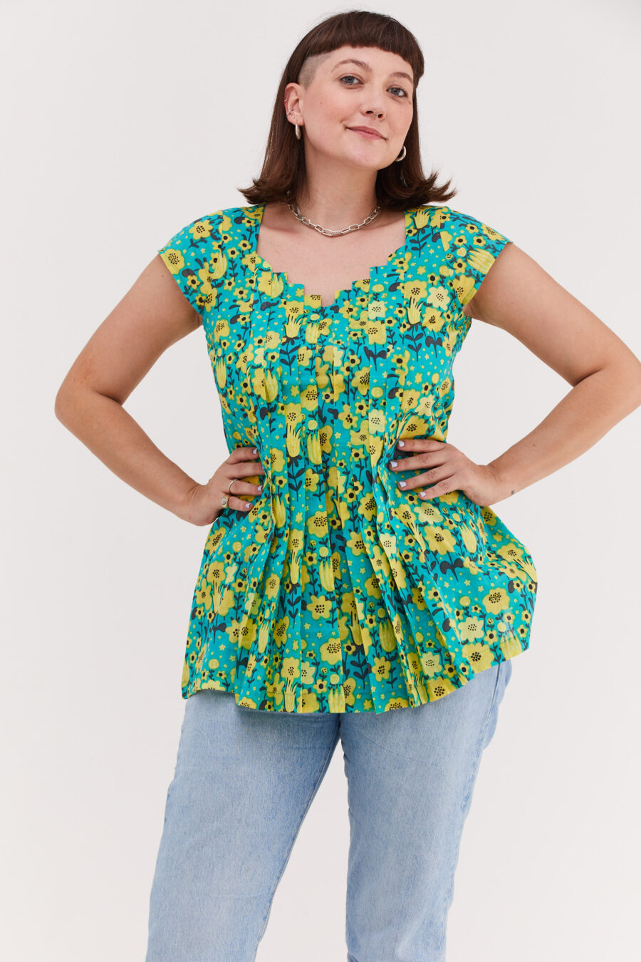 Serena tunic | Uniquely designed black dress – Optimism print, tourquise tunic with yellow flowers print by Comfort Zone Boutique
