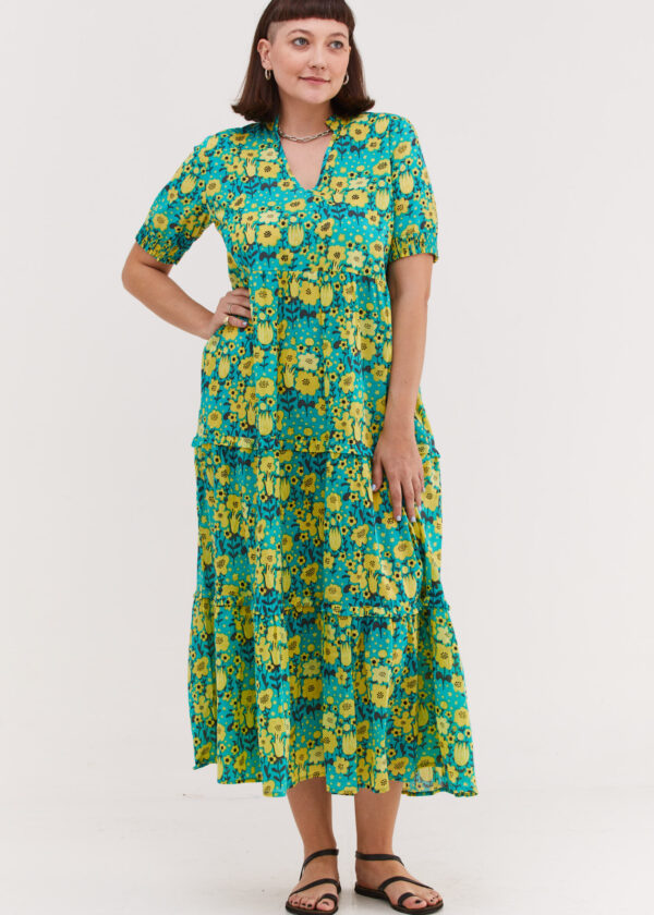 שמלת אפרת | שמלת מקסי בעיצוב ייחודי - הדפס אופטימיות, שמלה בצבע טורקיז עם הדפס פרחוני בצבע צהוב