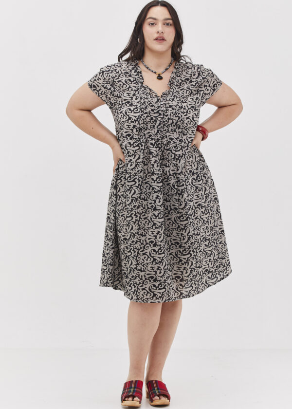 The Helena Dress - A Unique Midi Dress - Black Fantasy Print, a black dress with an abstract print in light gray. From Comfort Zone Boutique.